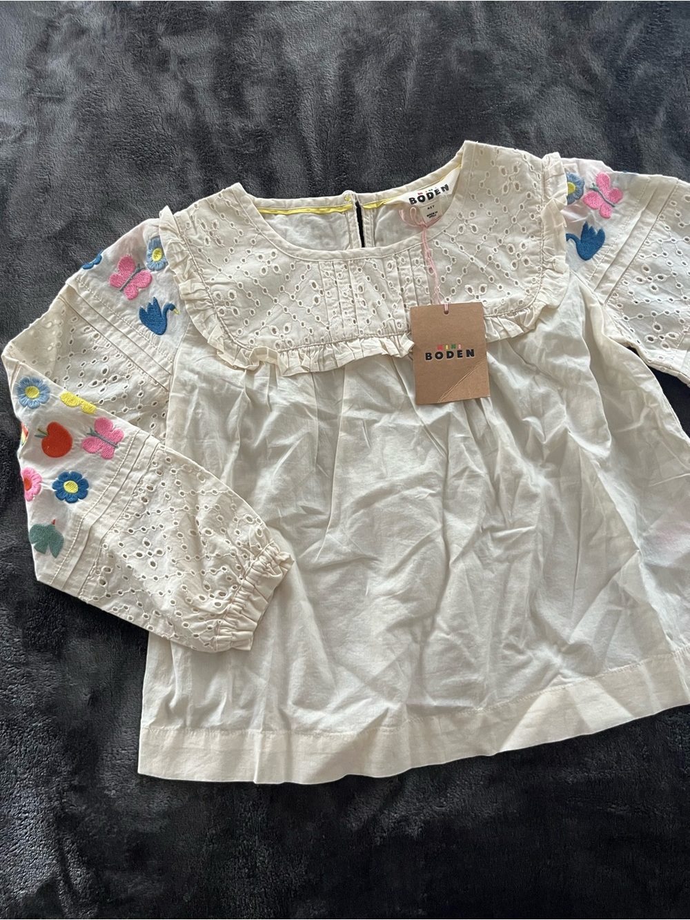 Mini Boden-  Girls' White Eyelet Blouse with Colorful Embroidered Sleeves